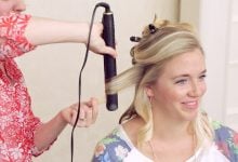 Demonstration on how to use a flat iron to get curls