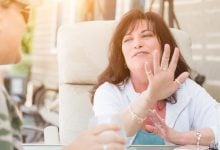 Woman using her hands to talk about her Energy Type