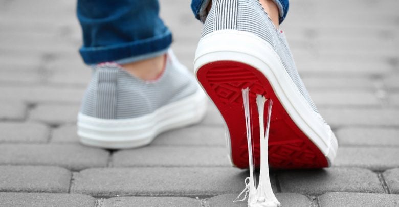 Person walking as gum gets stuck to the bottom of their shoe. What keeps you stuck?