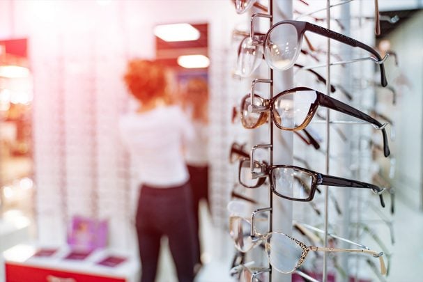 Woman choosing eyewear in a store