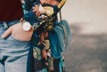 Woman carrying blue shoulder bag