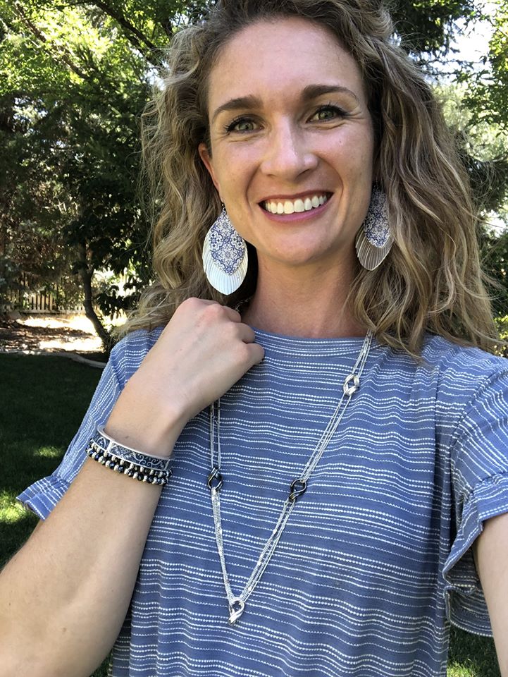 Lovely woman wearing detailed jewelry