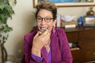 Carol sharing weight loss tips while holding a cupcake
