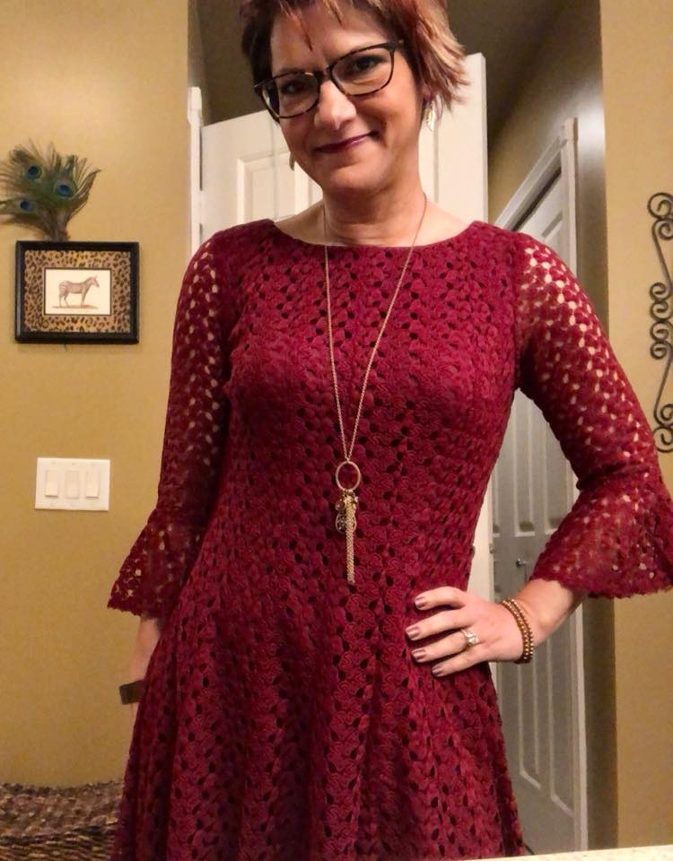 Woman in burgundy dress not wearing black for funeral