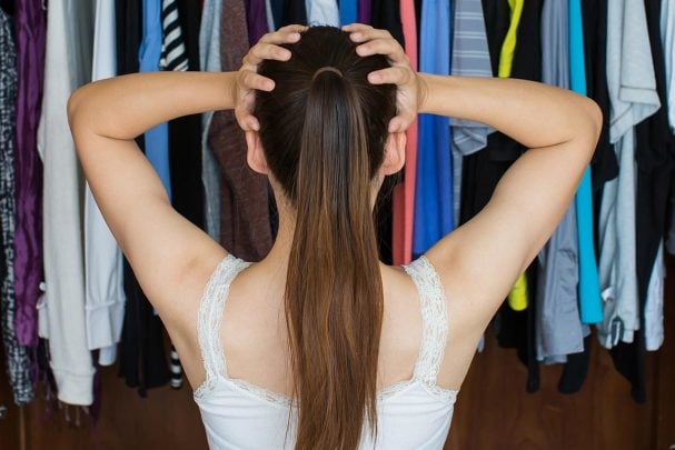 Woman standing in front of her closet - is Dressing Your Truth not working for you?